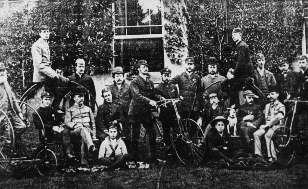 Cyclists outside a Rose Hill house